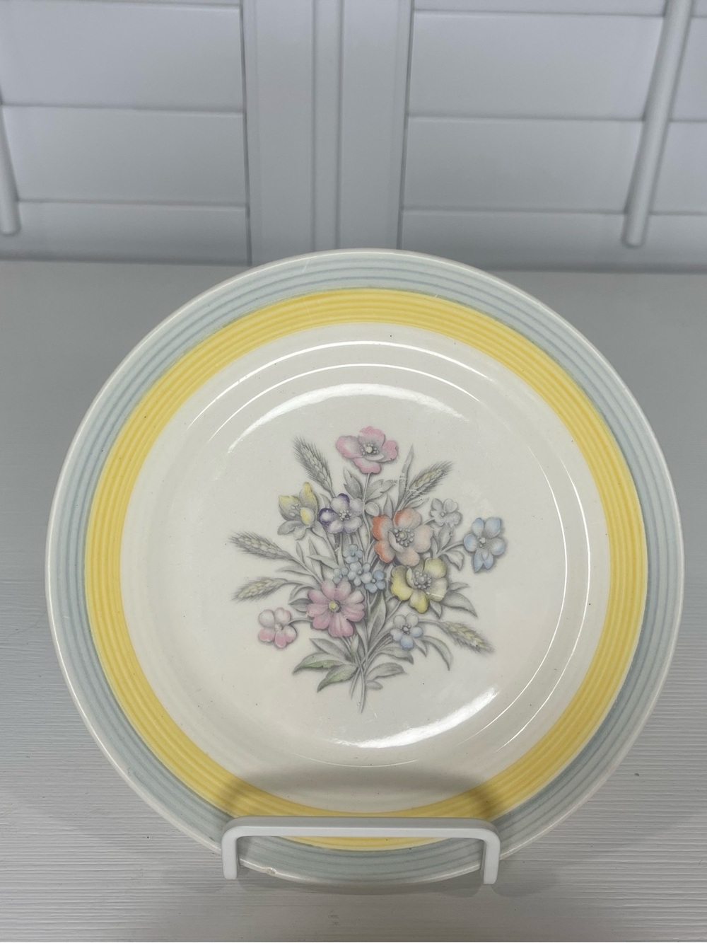 Triumph Ceramic 7.25” Plate with Yellow Rim and Pastel Floral Motif